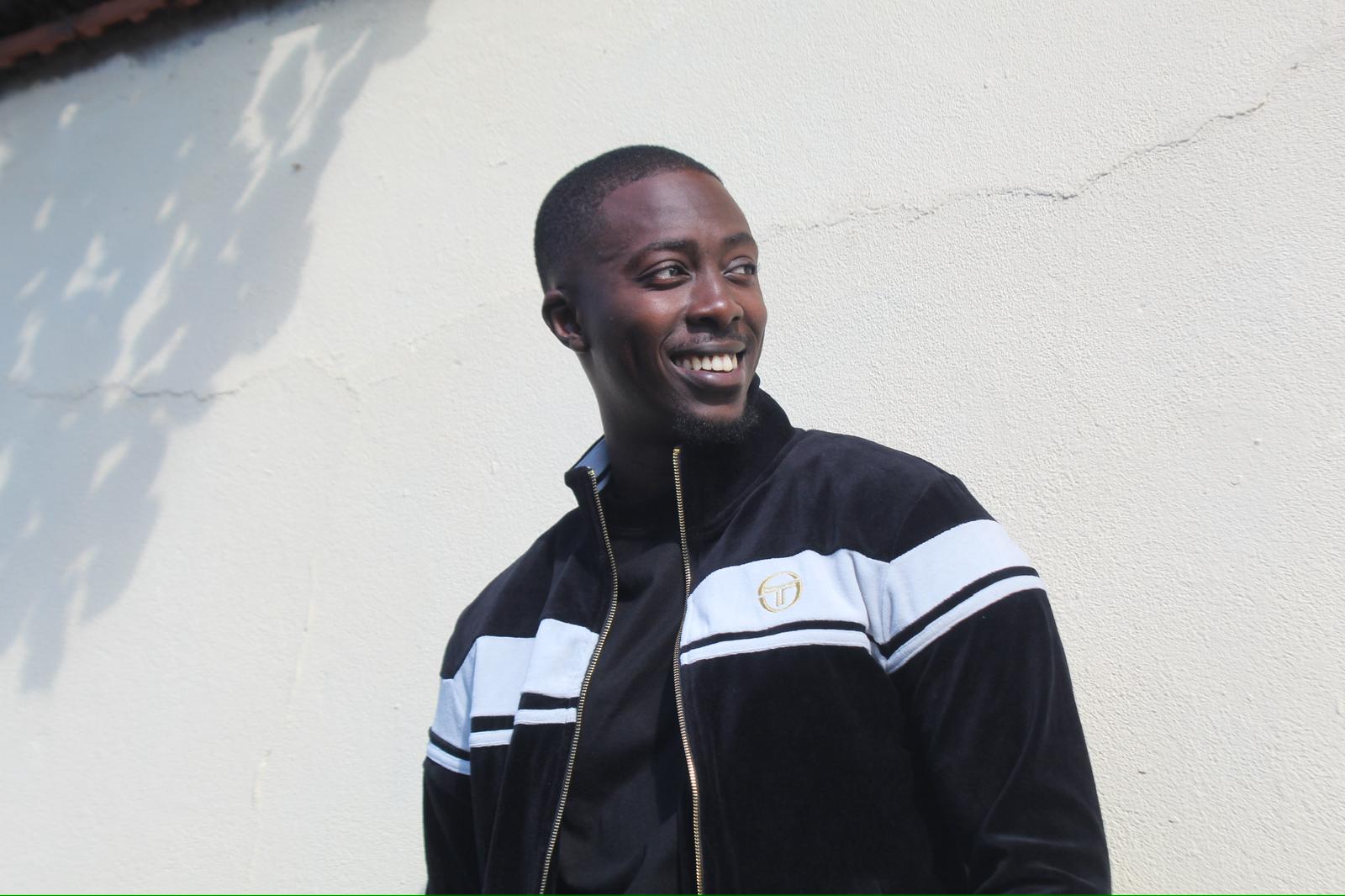Cheerful photo of Serigne, director of the camp and event organiser.